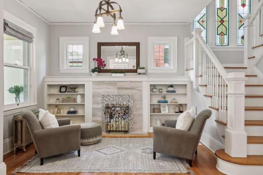 This great sitting room is right off the front entry and is another beautiful space with built-ins.