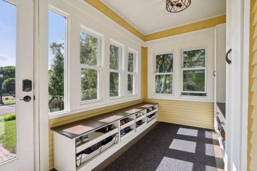 Front porch was enclosed to create this great usable and beautiful mud room space.