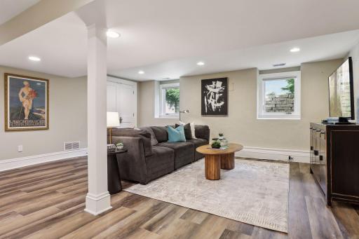 Nicely updated family room space on the lower level with large windows and ample natural light.