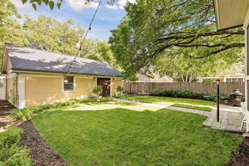 Great backyard green space with new sod and great professional landscaping.
