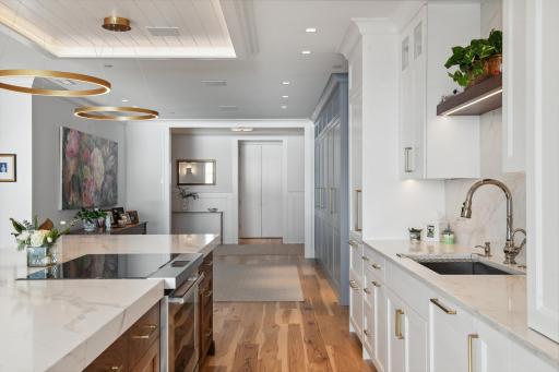 Notice the gallery space as you enter the home! Open and airy, you'll never be limited to the amount of guests you invite over. Uncharacteristic large and practical!