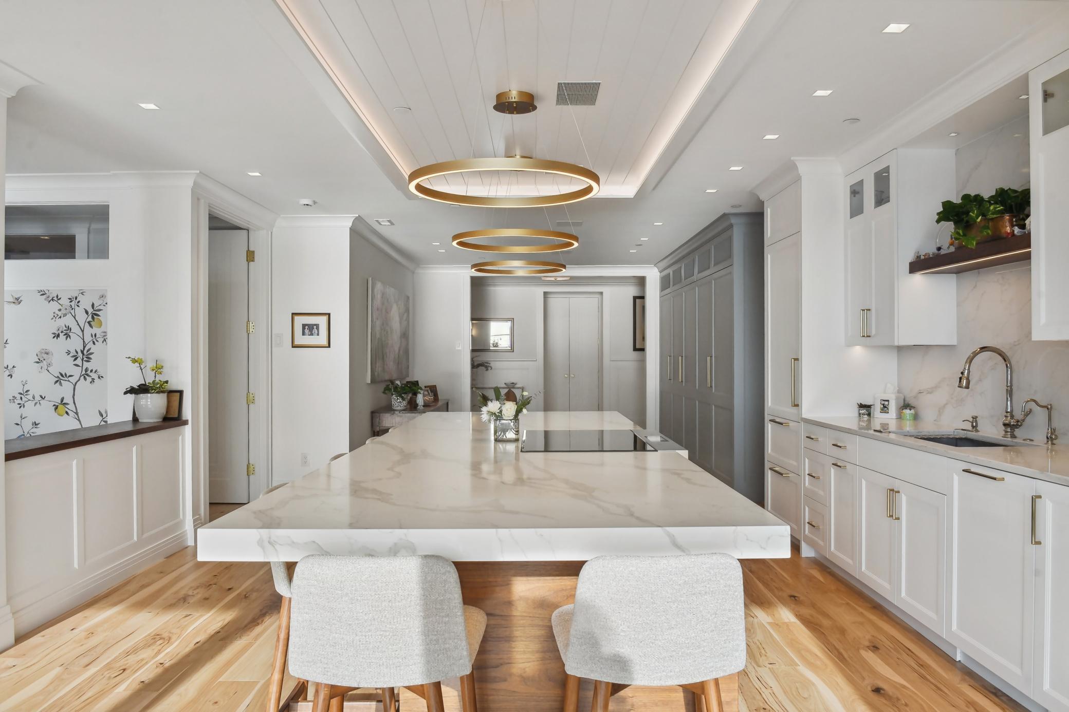 You will appreciate the thoughtful storage behind a mirage of smartly designed cabinetry.