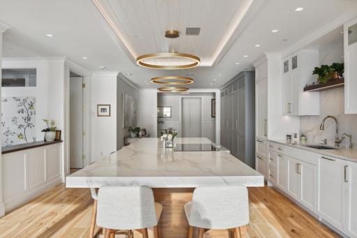 You will appreciate the thoughtful storage behind a mirage of smartly designed cabinetry.