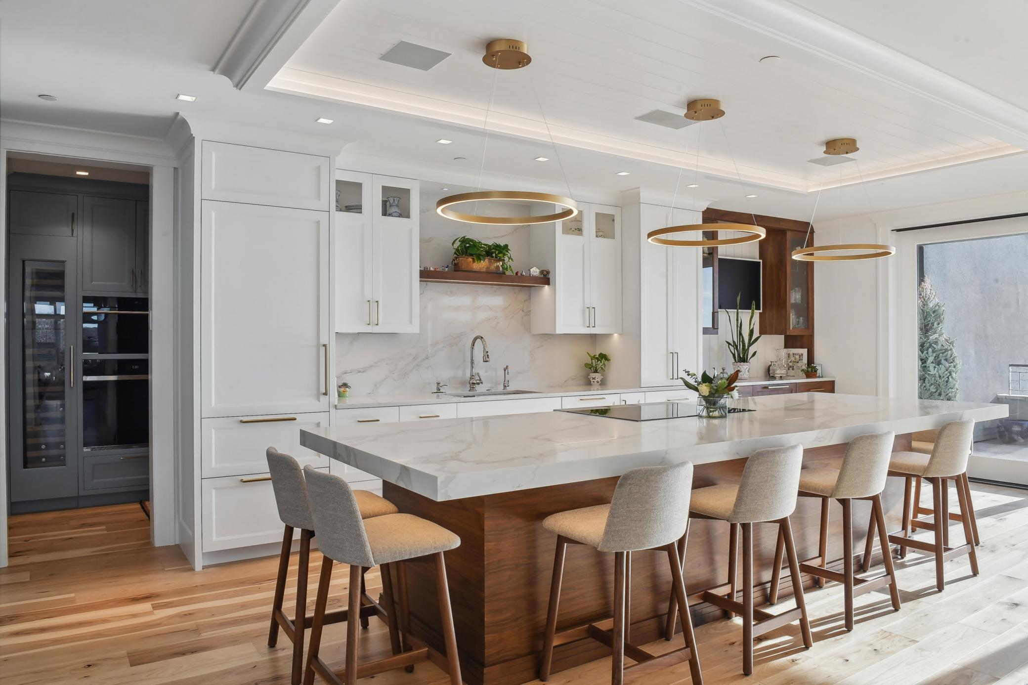 The gourmet kitchen is impressive. Natural light floods the space, highlighting the modern design.