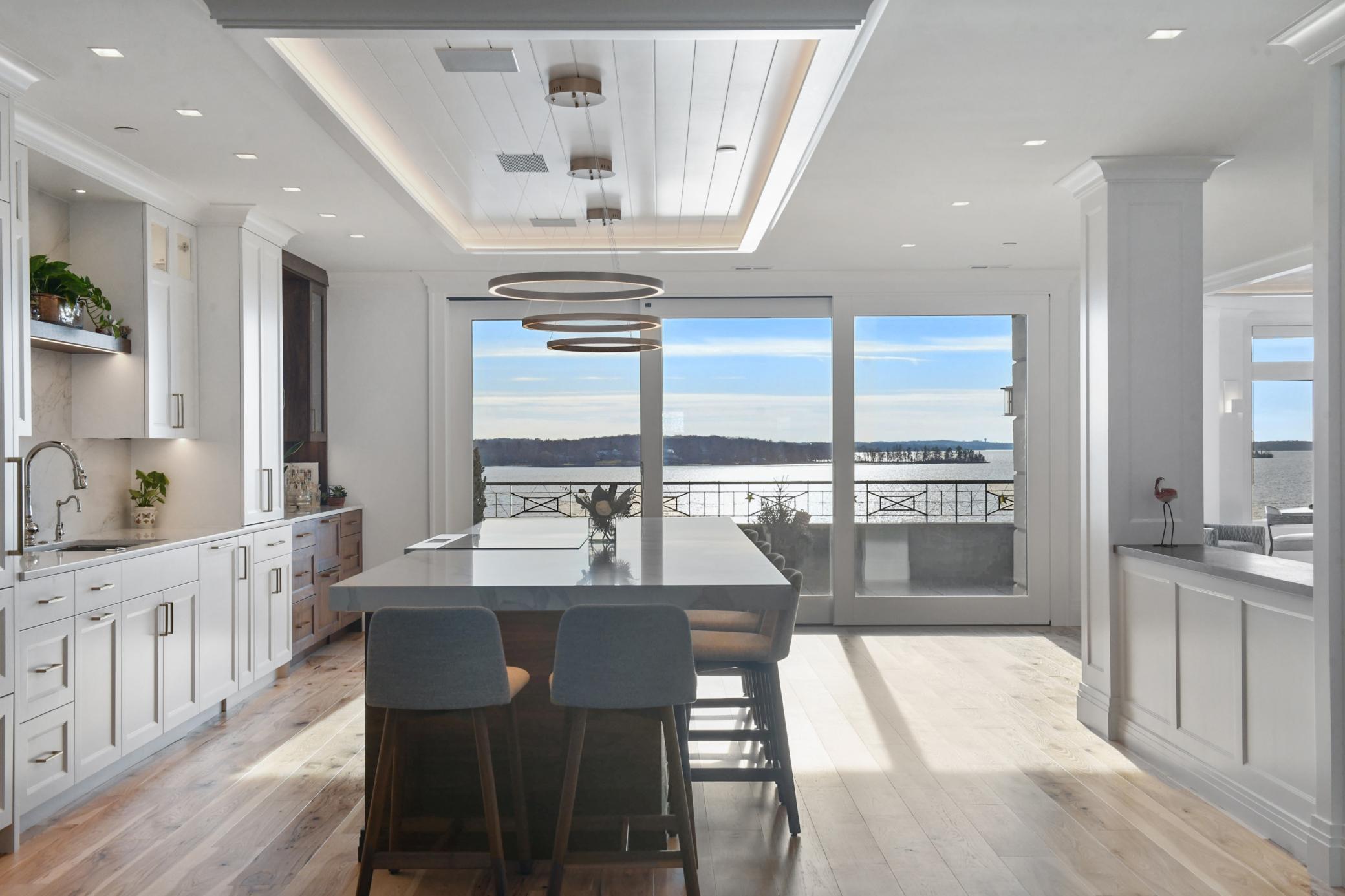 Hickory Hardwood flooring is the perfect compliment to the natural walnut, enameled trim and millwork throughout.