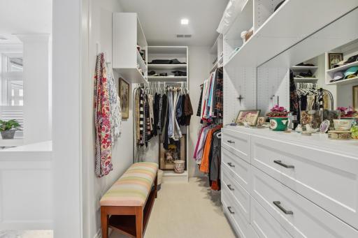 Two separate walk in closets with unique customization.
