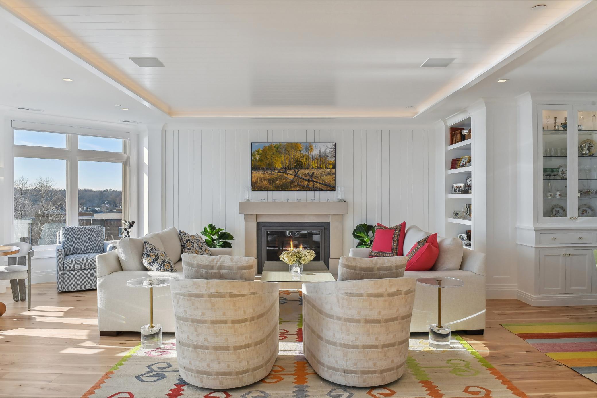 Notice the detail of the beautiful gas fireplace and wall and ceiling millwork- Gorgeous!