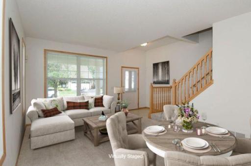 Formal living and dining room is open, bright and airy