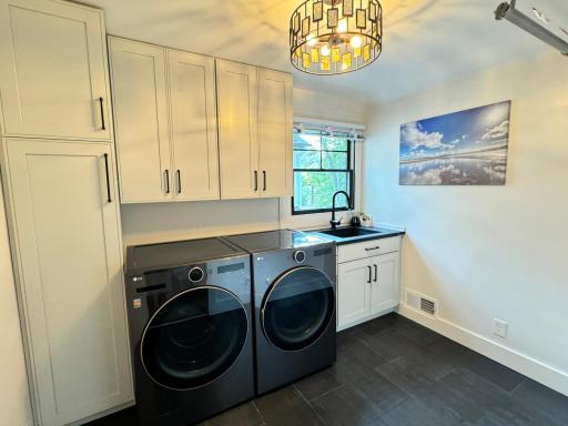 Laundry room located on the second floor to service the 4 rooms on the same level. Heated tile floors.