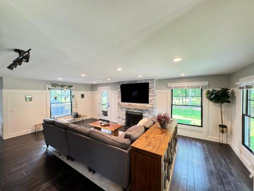 Bright and open living room. Hand-scraped wood floors