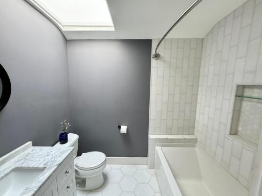 Spare bathroom servicing the guest rooms on the second floor. Heated floors.