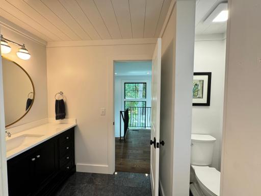Powder room with heated floors in the second wing