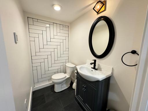 Bathroom in the basement level with heated tile floors
