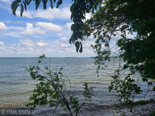 Premier property on the point that captures lake breezes from several directions.