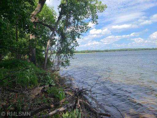 Straight up the shoreline and little turn you left you will find a sand bar so a premier location on the lake.