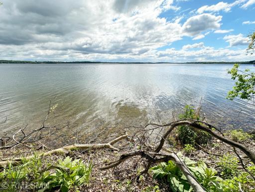 Wooded level lot with great shoreline the formula you are desiring when it comes to a lake property.