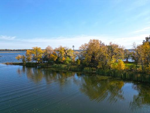 With its supreme shoreline, beautiful views, level wooded setting, and rare acreage, this property offers the ideal combination for creating your ultimate lake retreat.