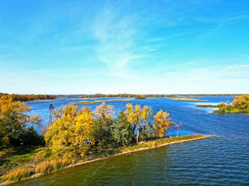 Located on Williams Point, this exceptional property offers just over 2 acres of wooded, level land with some of the finest hard-bottom shoreline on the lake.