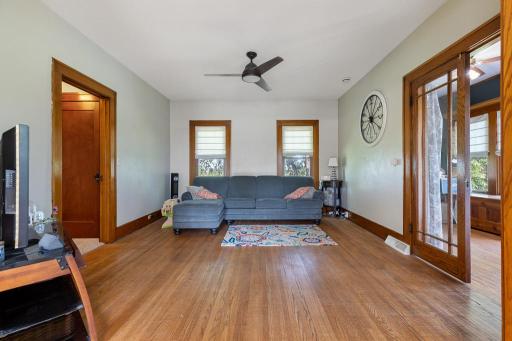 The hardwood flooring extends in to the living room and sun room