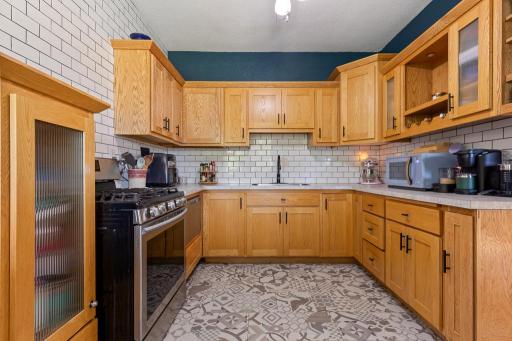 This kitchen has been fully revamped in the last couple of years - plumbing, flooring, subway tile, countertops, and MORE!