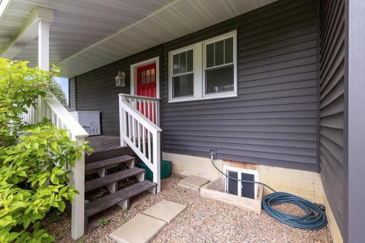 The covered front porch welcomes you and also provides an additional outdoor space to sit and relax, rain or shine!