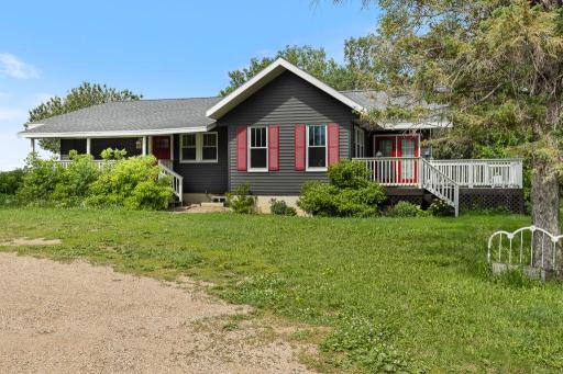 The freshly painted doors and shutters provide an eye-catching contrast for some fun curb appeal!