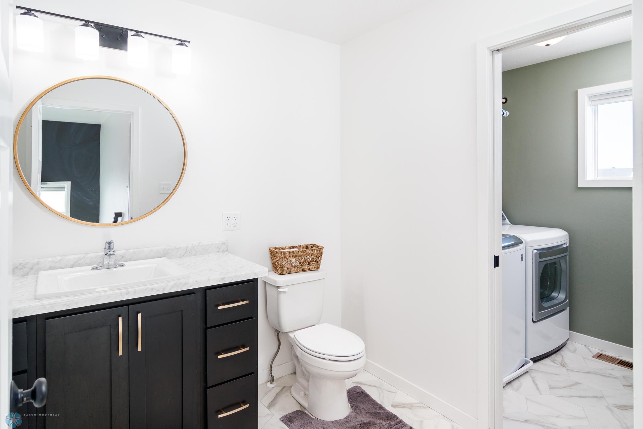 Full bathroom with laundry room