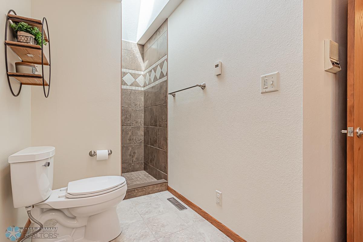 Primary bathroom 2 with skylight