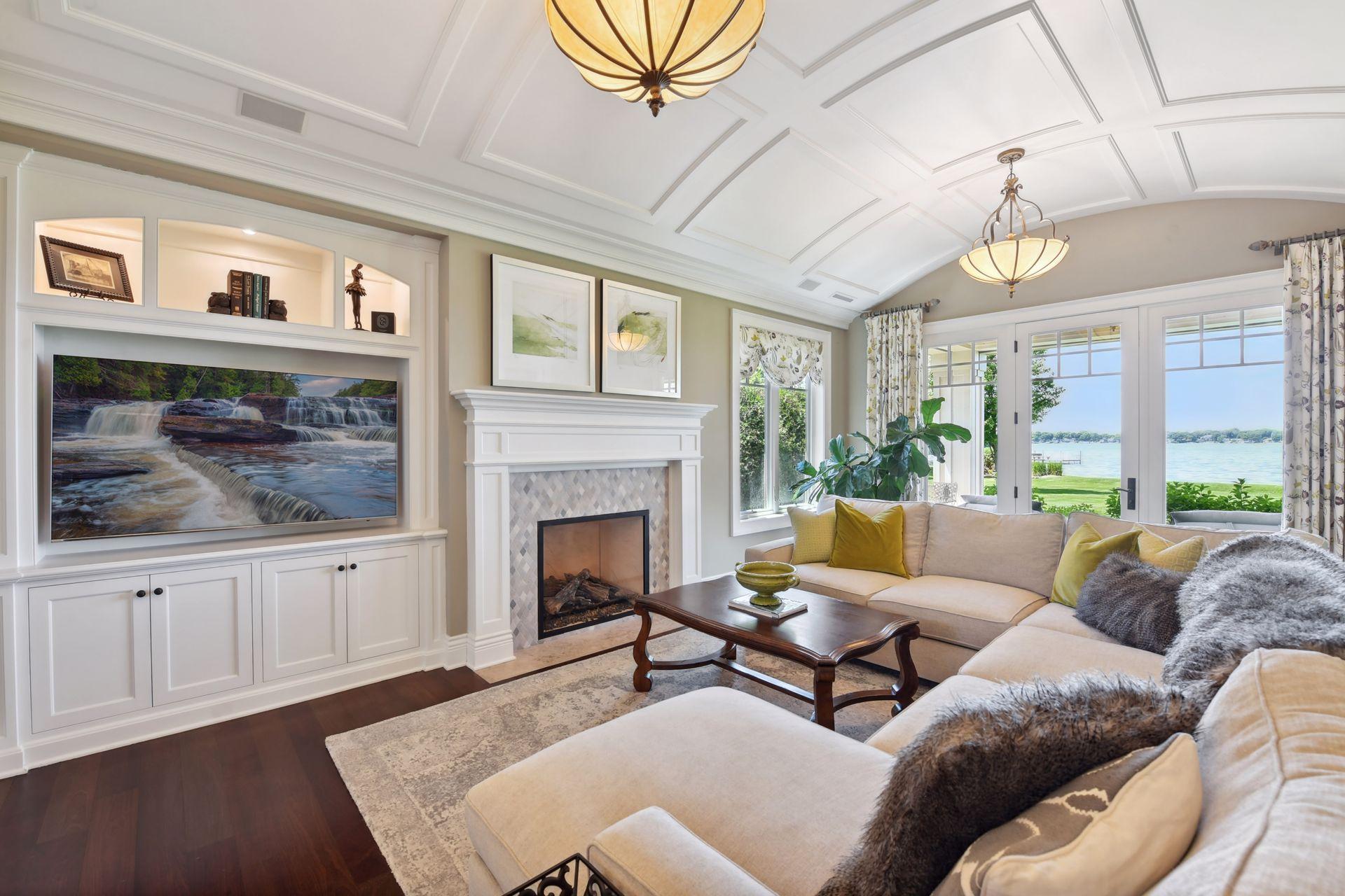 Gas fireplace, built-in shelving, dramatic lighting