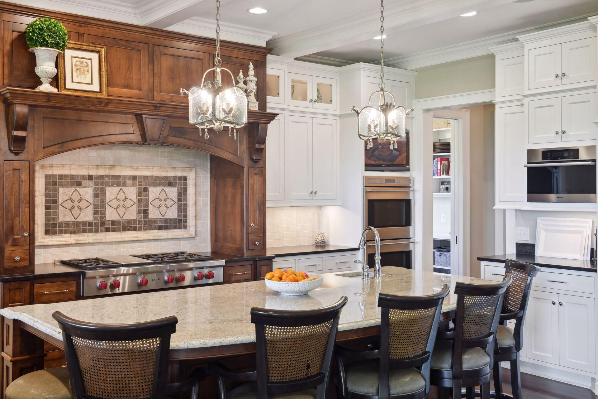 Wolf 6 burner + grill cooktop, wet bar sink in-island, pantry