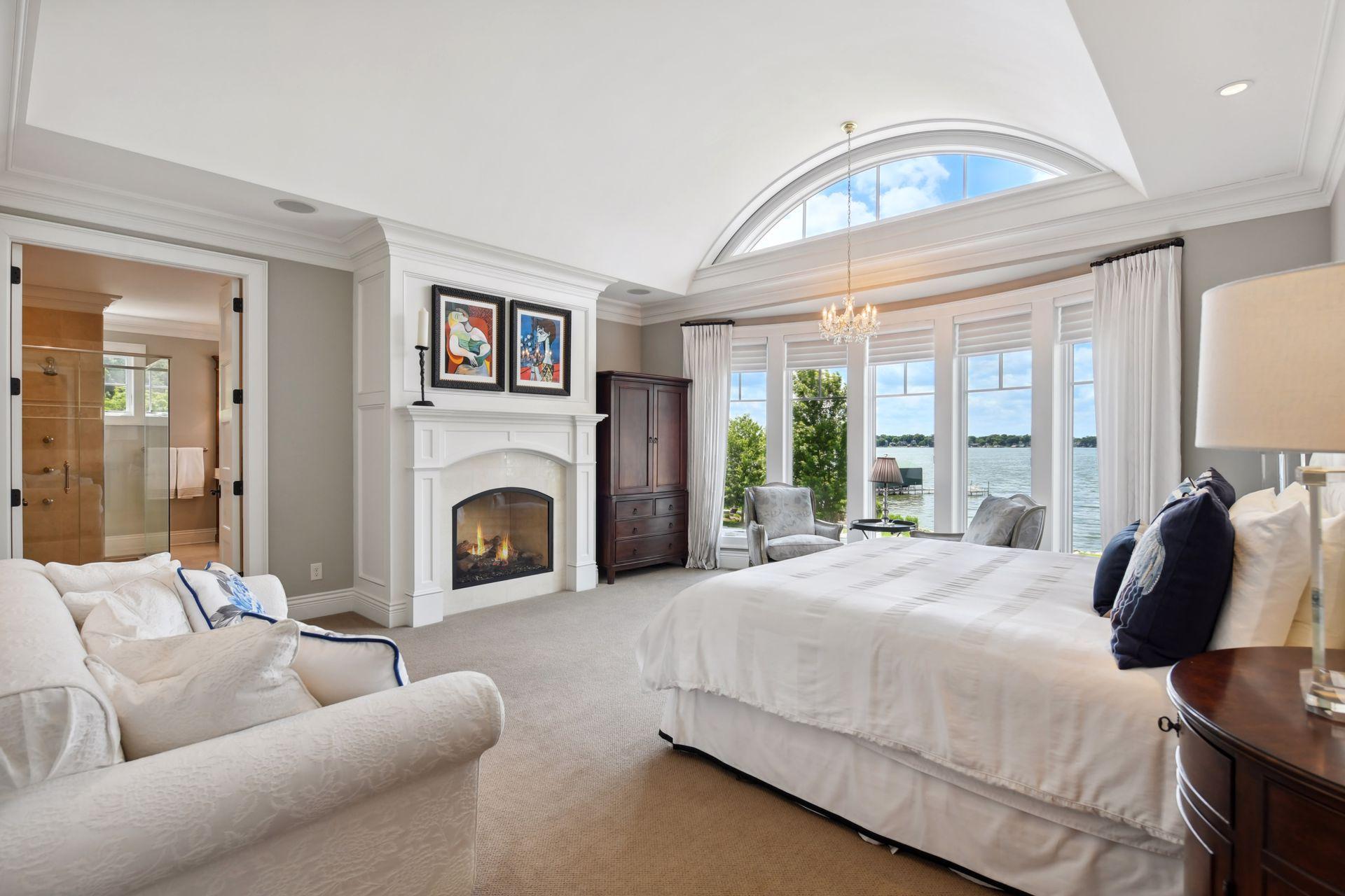 Spa-like primary suite with gas burning fireplace and blakc-out shading on controls