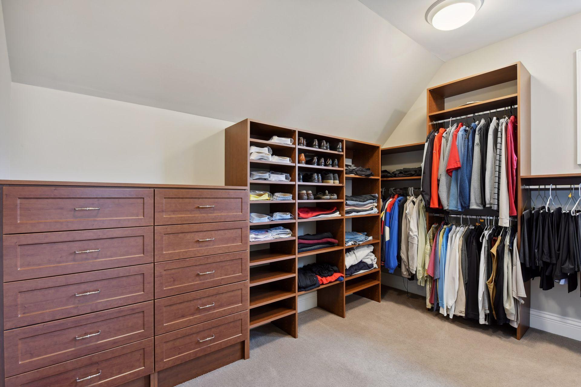 His walk-in closet with built-in dresser