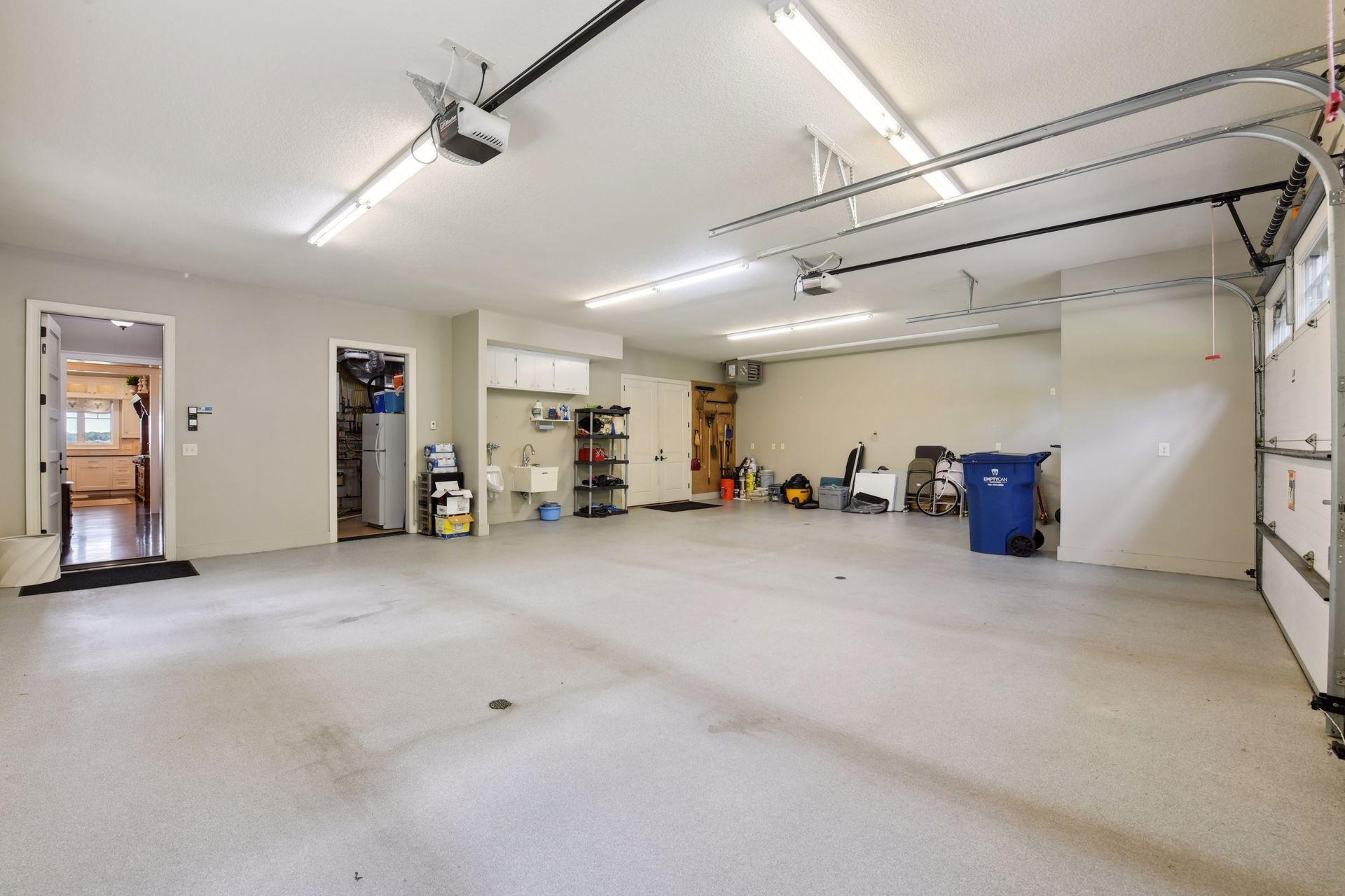 Heated, drained garage with urinal and utility sink, expoxied flooring