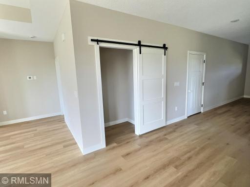 The large walk in pantry with a sliding door is just off the kitchen but easily accessible.