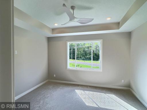 The private primary suite is a true retreat, featuring a well-planned layout that connects the bedroom, large walk-in closet, laundry area, and a luxurious en-suite bath â all designed for maximum comfort and convenience.