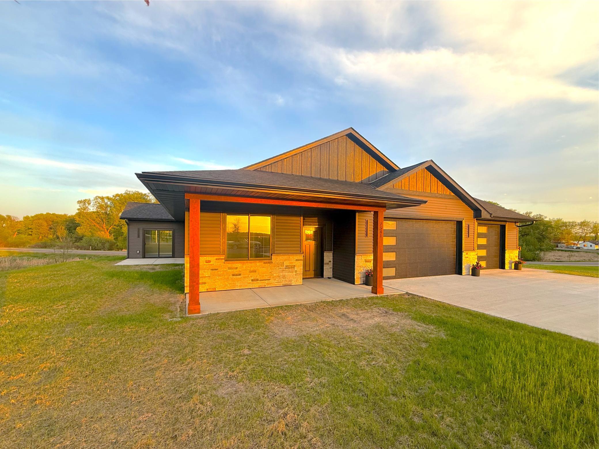 Step onto the charming open front porch or relax on the oversized side patio, both ideal for outdoor entertaining and perfectly positioned to capture the sights and sounds of the water and the neighborhood.