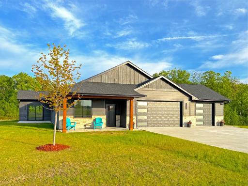 Step onto the charming open front porch or relax on the oversized side patio, both ideal for outdoor entertaining and perfectly positioned to capture the sights and sounds of the water and the neighborhood.