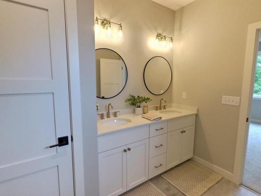The primary bath will have a double sink with large vanity, walk in tile shower and spacious linen closet.