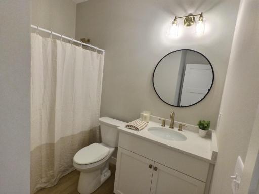 The full bath sits next to the 2nd bedroom and just off the entrances for easy use by everyone.