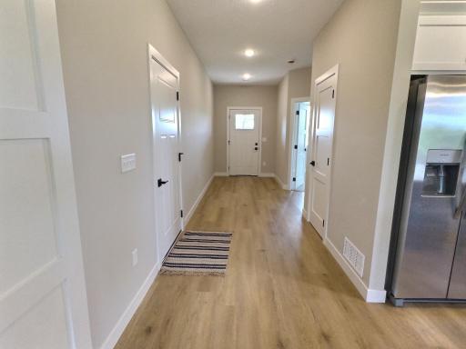 Entryway showing the access to the garage and entry closet as you enter the home.