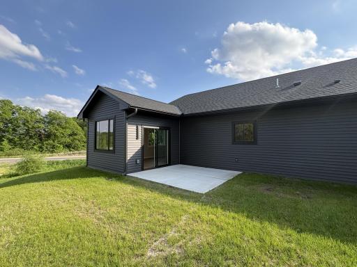 The patio is located off the sun room. This will be a great exterior entertaining area that will over look the area, the lake and the neighborhood.