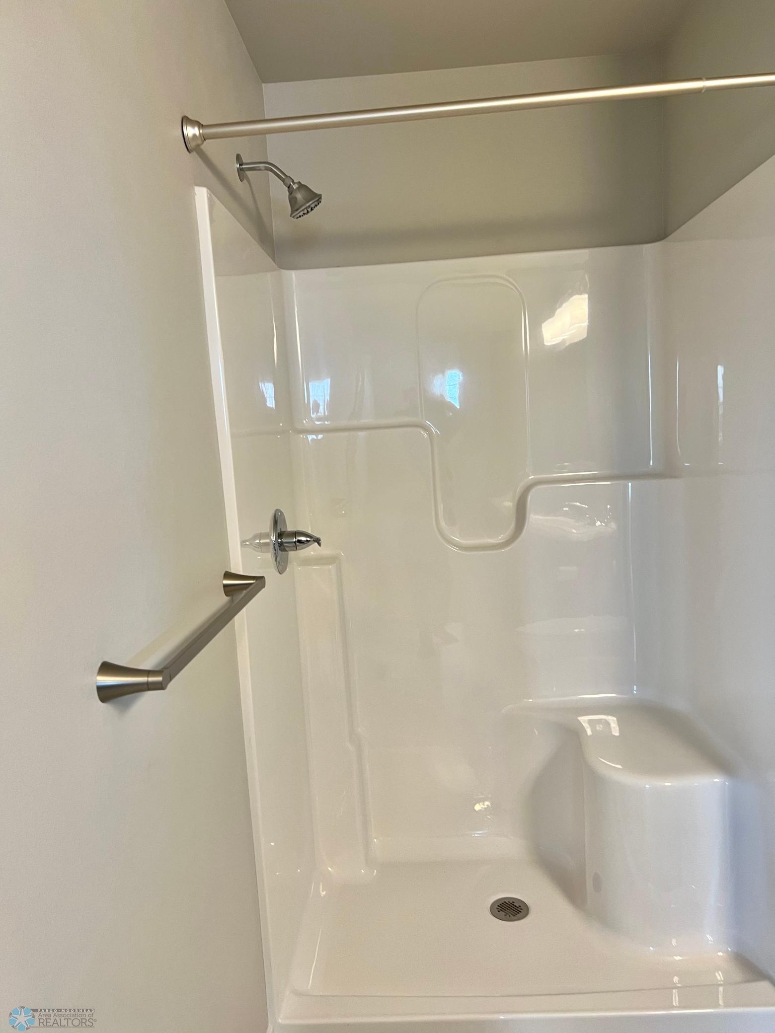 Primary bedroom with large step in shower