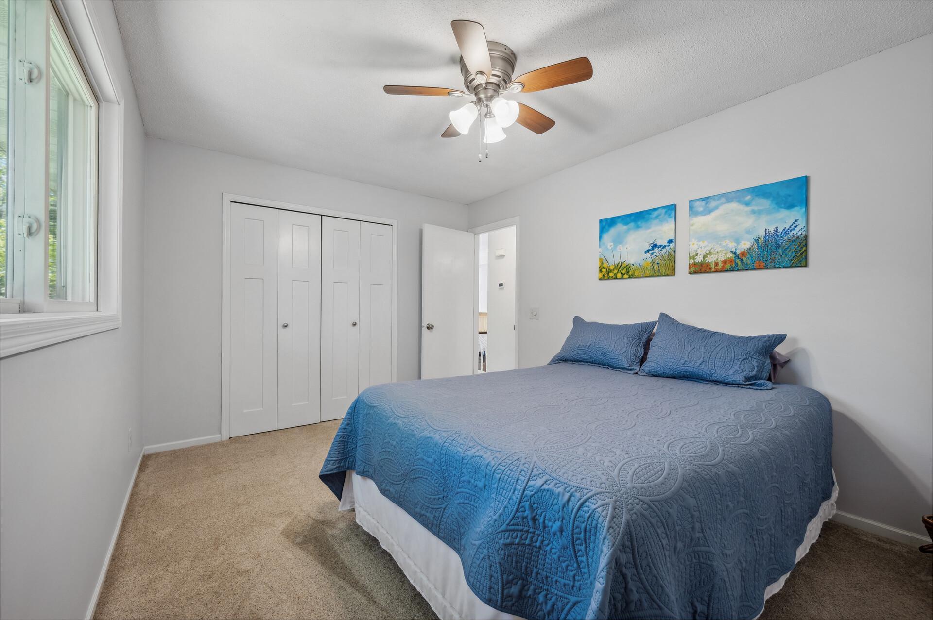 Spacious bedroom with ceiling fan