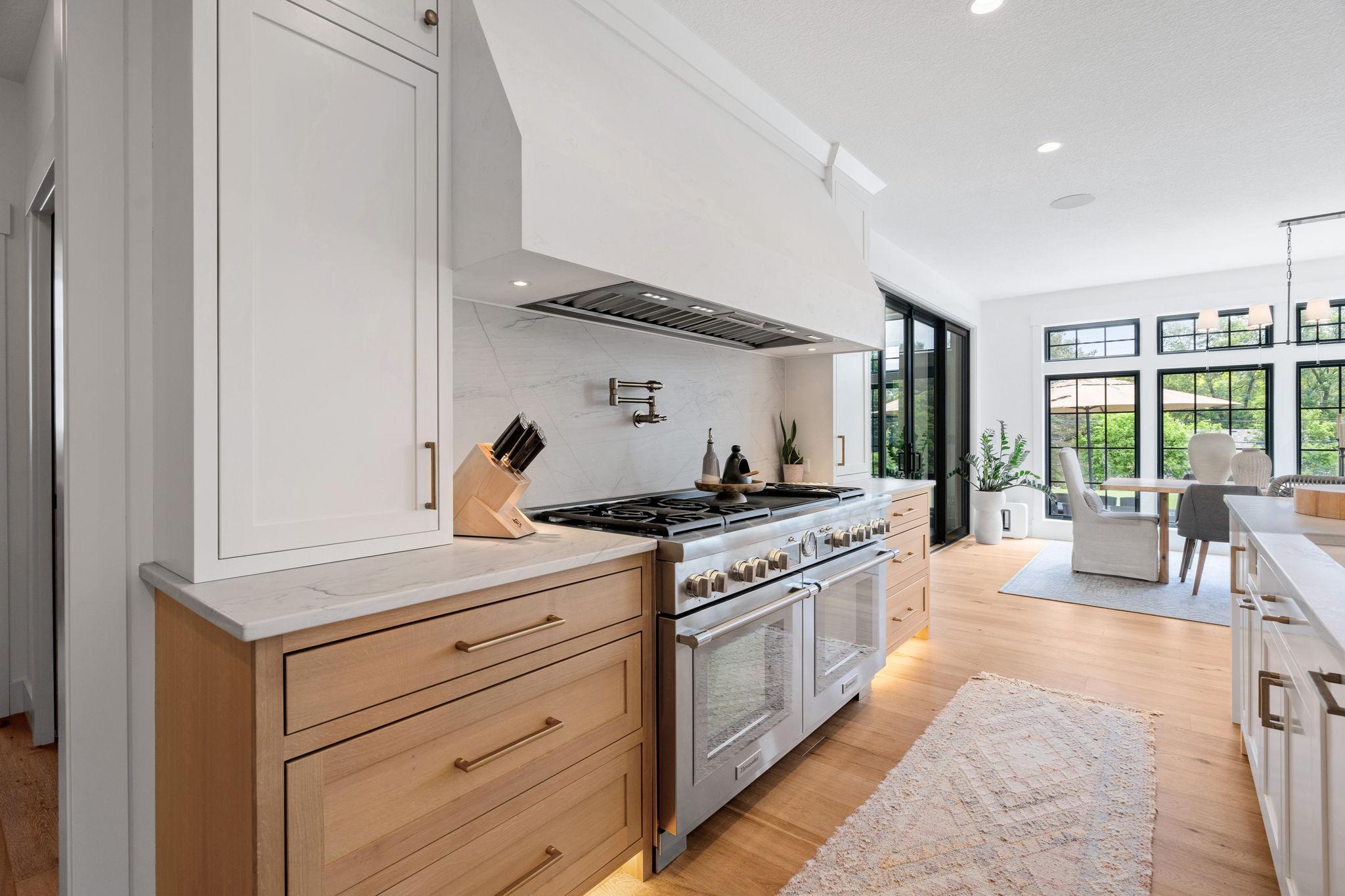 Top of the line Thermador appliances in the kitchen along with inset dovetail drawers that provide ample storage with a high-end finish that enhances the kitchen’s modern aesthetic.