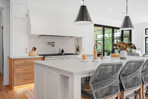 High-end Brizo pot filler and faucet add both style and practicality, making meal prep and clean-up effortless.