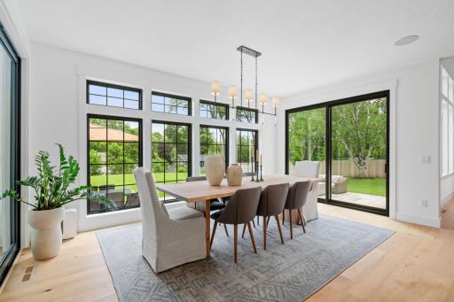 Gorgeous dining room provides access to 3 season porch and the large patio out back.