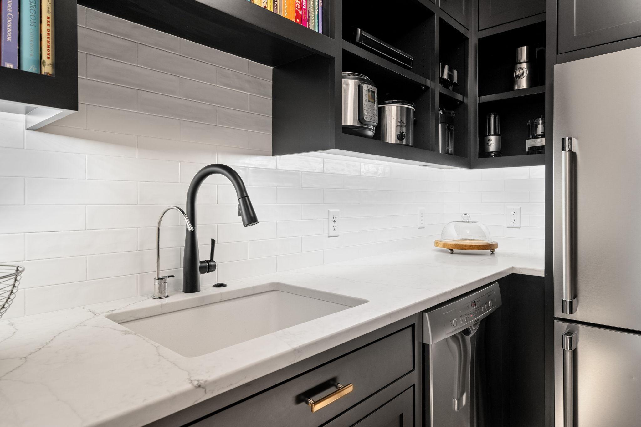 Under-cabinet lighting brightens the workspace, providing both functionality and ambiance.