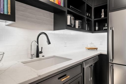 Under-cabinet lighting brightens the workspace, providing both functionality and ambiance.
