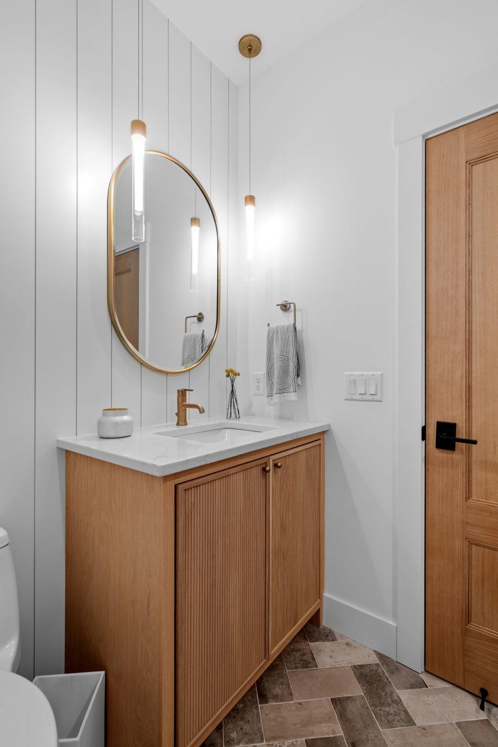 Three fourth bathroom located on the main floor with tile floors and shower surround.