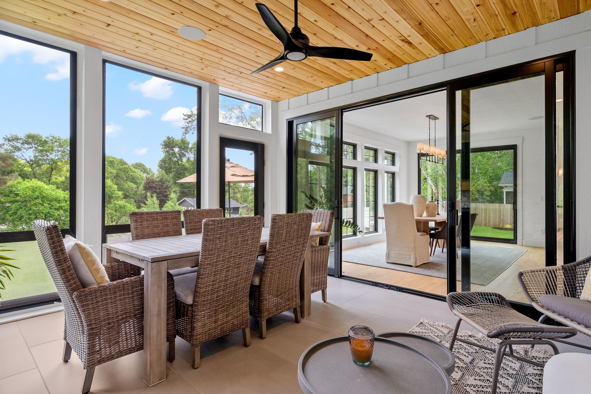 The large tile floor adds a touch of sophistication while ensuring durability and ease of maintenance. This space is thoughtfully designed w/EZ screens that provide flexibility.